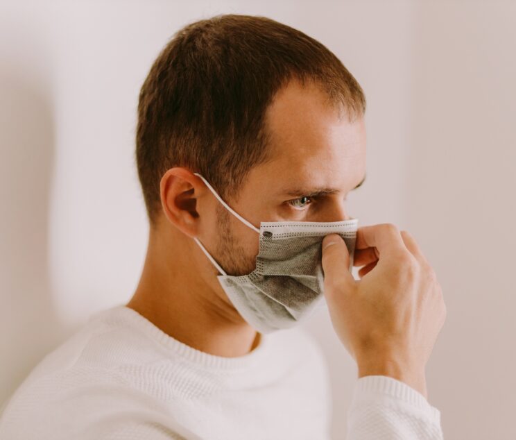 man wearing face mask for virus prevention on quarantine