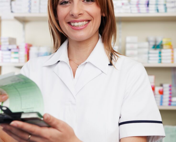 Pharmacist looking at prescriptions