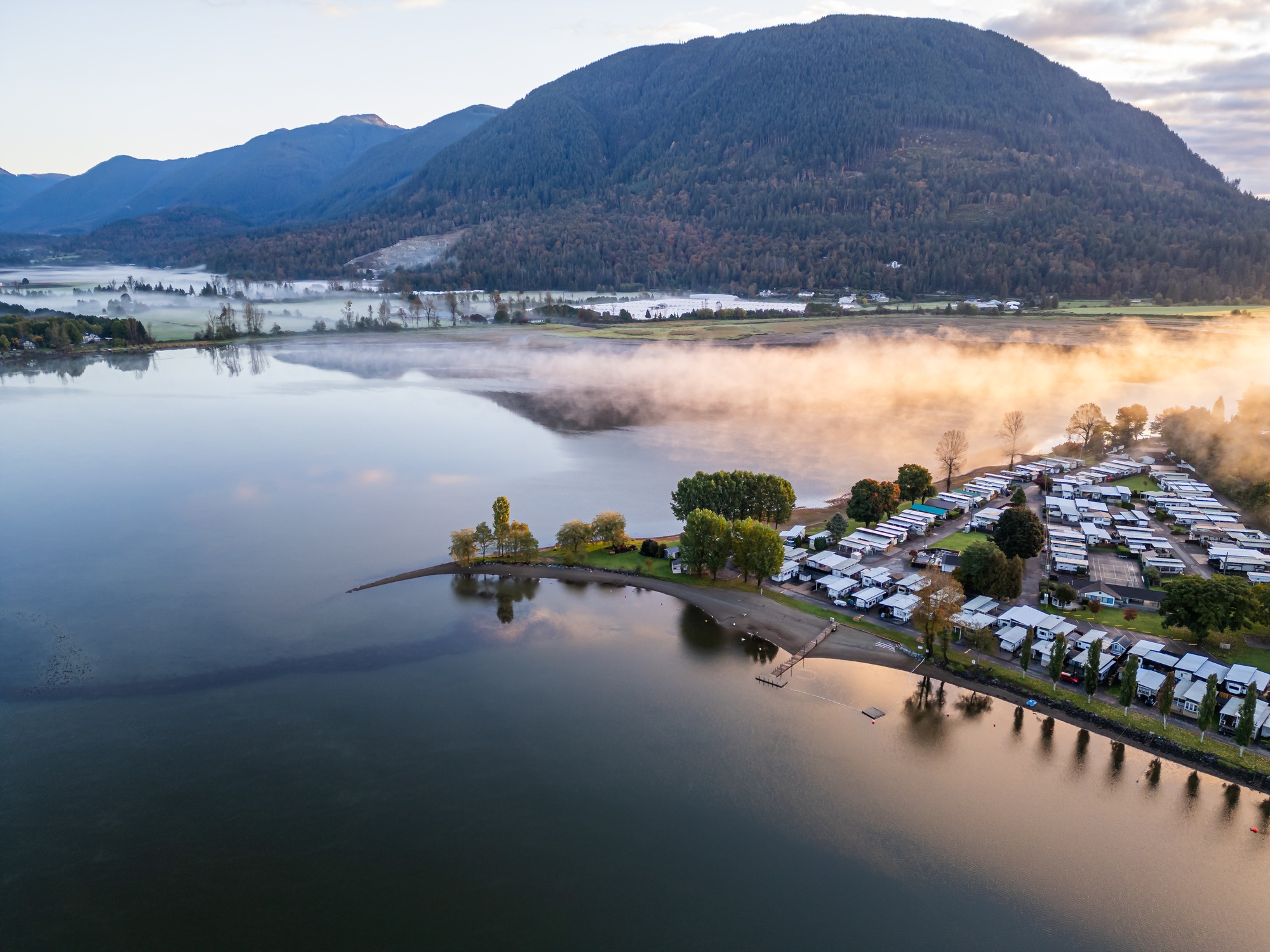 Scenic Aerial View of Mission, BC, Canada: Tranquil Morning Mist over Waterfront Community