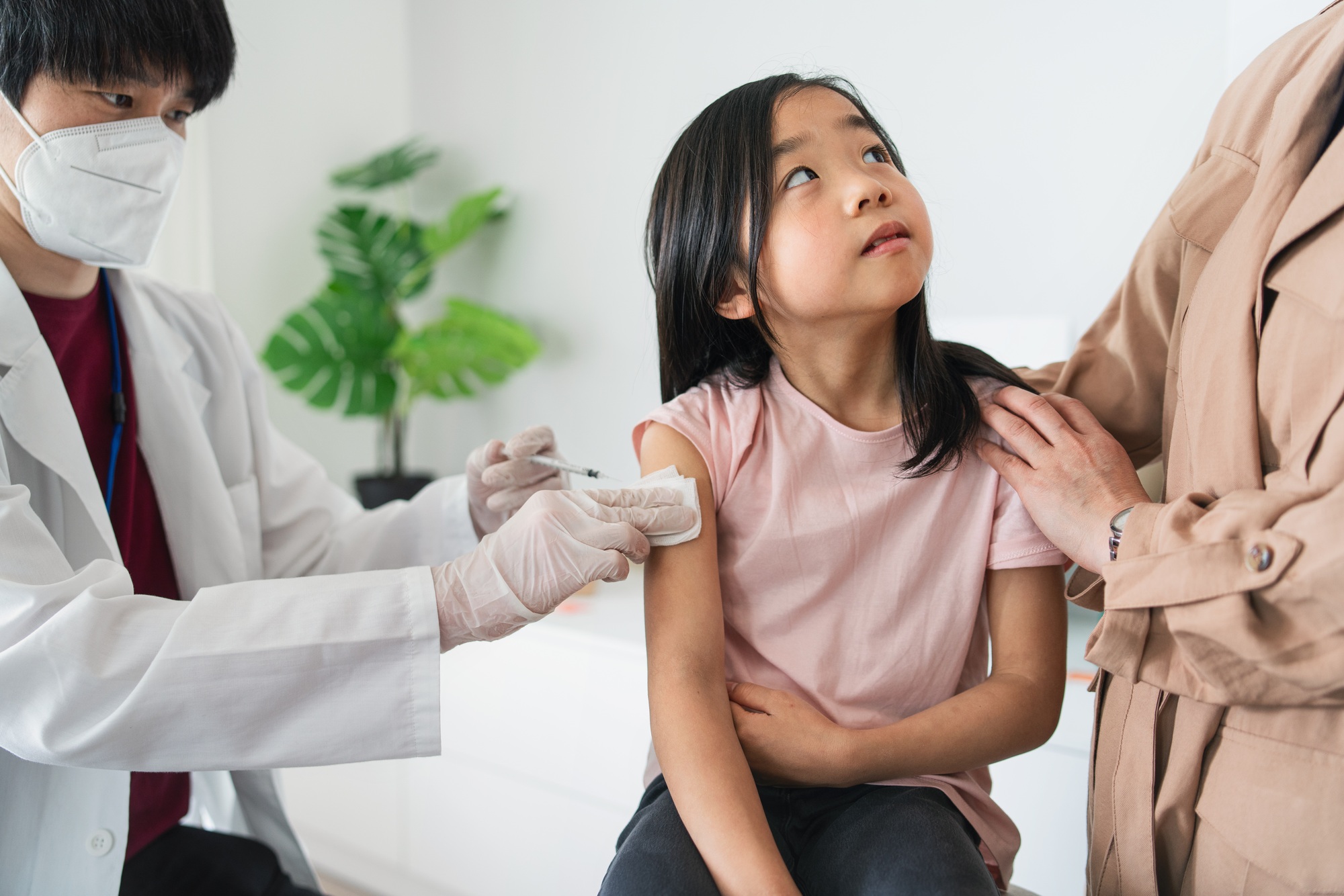 Vaccination of small child, coronavirus and covid-19 concept